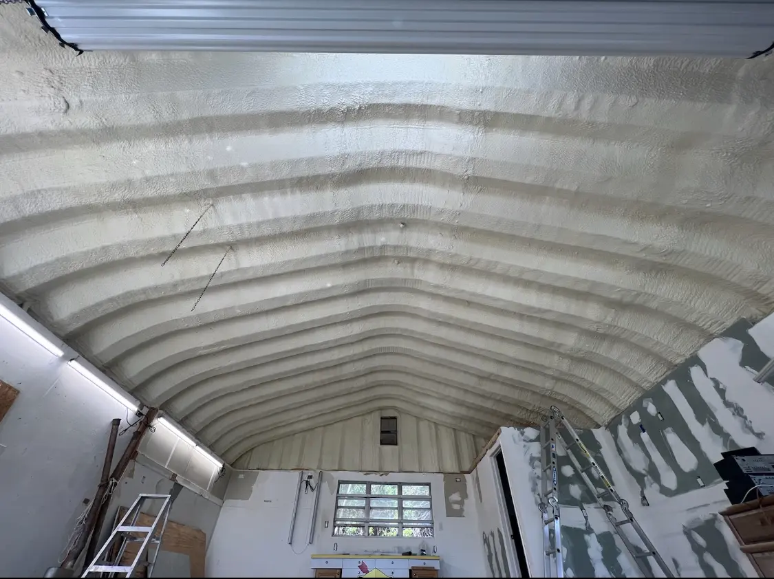 Spray polyurethane foam applied to the underside of a metal roof deck in Columbus